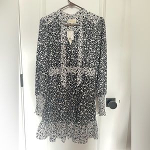 Tie-neck, black and white blouse. NWT